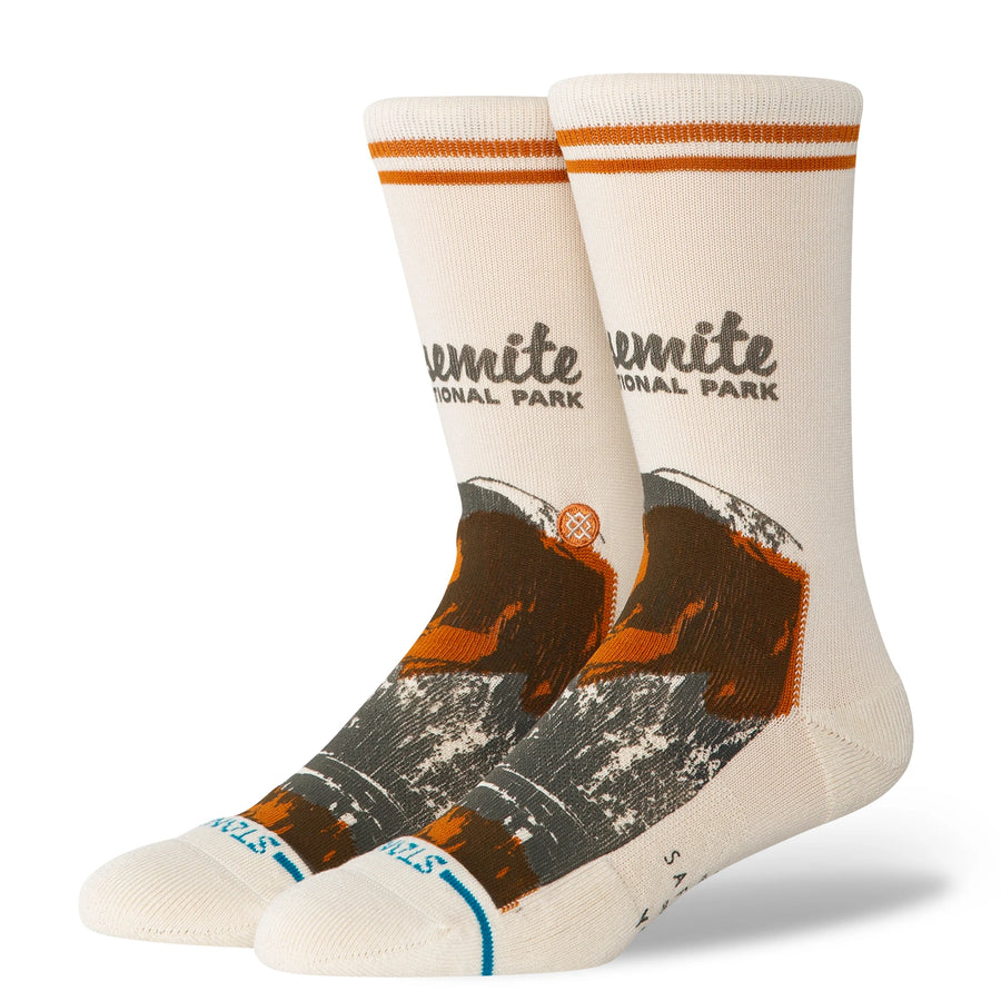Pair of stance x national parks crew socks with Yosemite National Park design on a white background