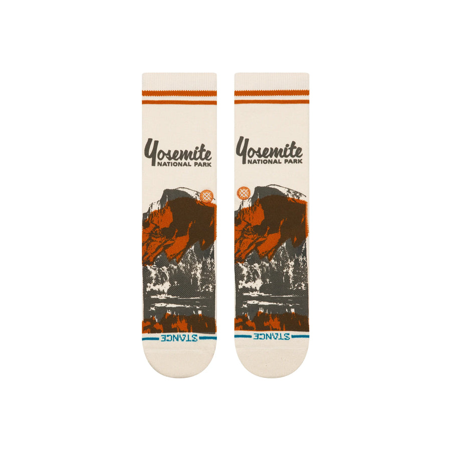 Pair of stance x national parks crew socks with Yosemite National Park design on a white background