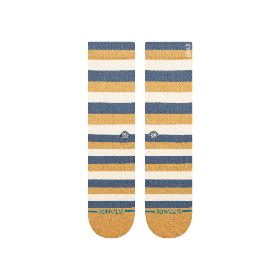 Pair of striped stance butterblend hiland socks with blue, yellow, and white colors on a white background