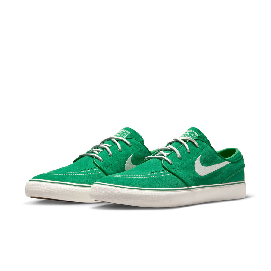 Green nike sb janoski skateboard sneaker with white swoosh logo on a white background