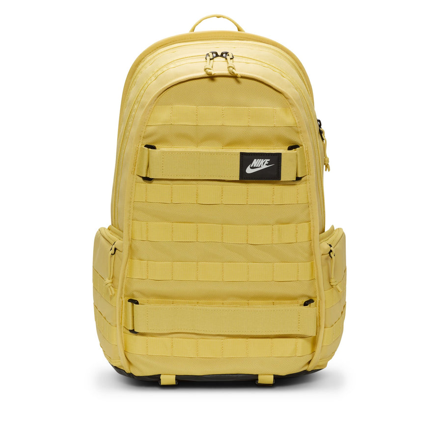 Yellow nike sb prm skate backpack with Nike logo on a white background