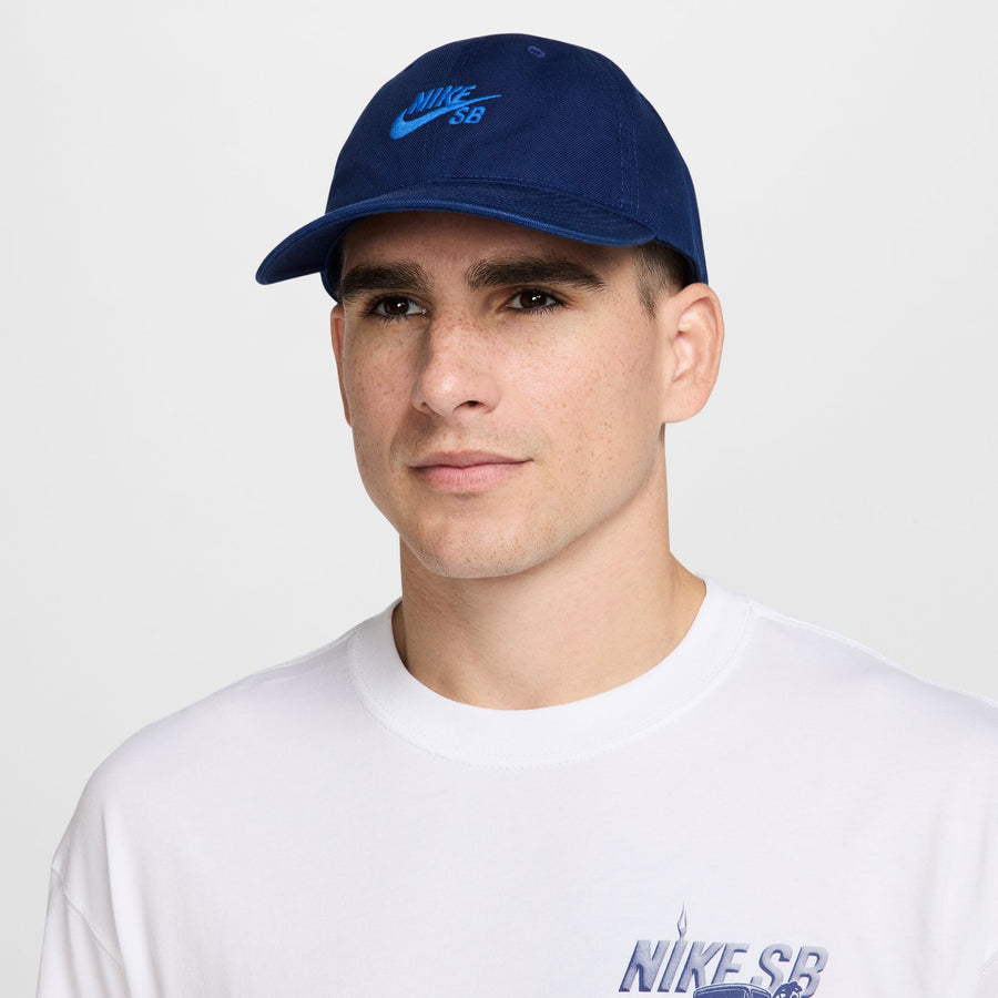 blue nike sb hat with light blue font