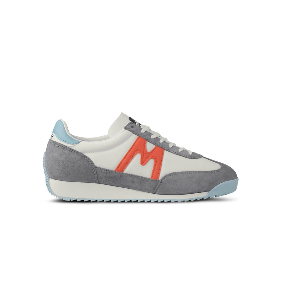 grey karhu men's mestari sneaker with red M logo and blue details