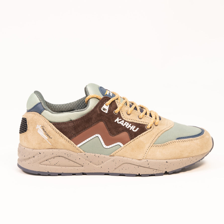 brown and green karhu men's and women's comfort shoe