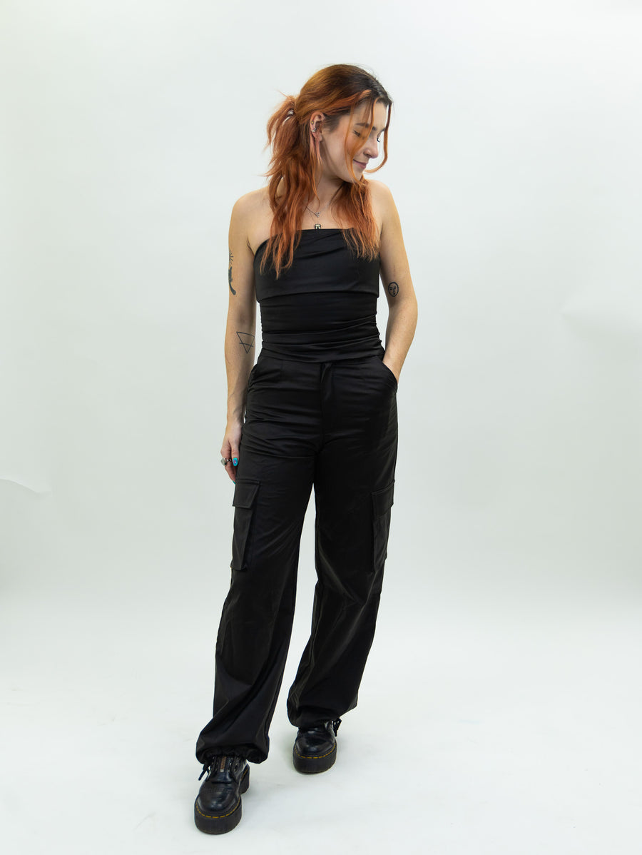 black nia Mid-rise thick satin parachute pants featuring patch pockets and adjustable ties at the ankles