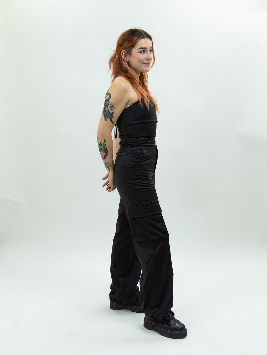 black nia Mid-rise thick satin parachute pants featuring patch pockets and adjustable ties at the ankles
