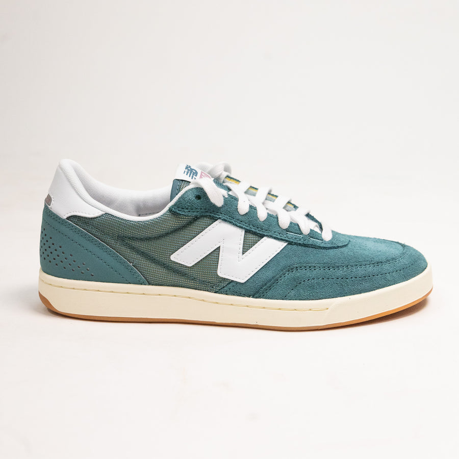 green men's new balance shoe with white sole