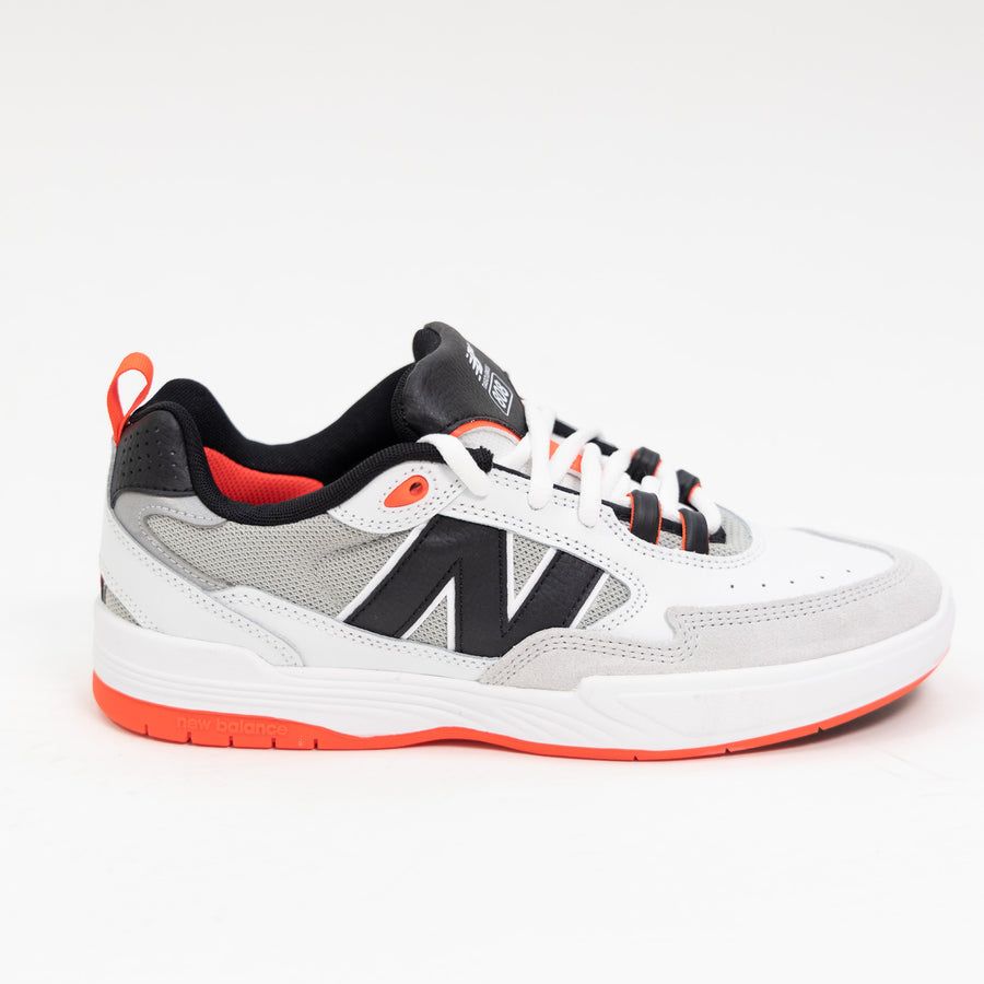 white and black new balance men's skate shoe with bright red detail