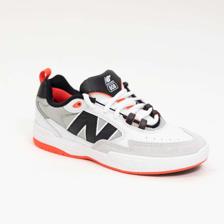 white and black new balance men's skate shoe with bright red detail