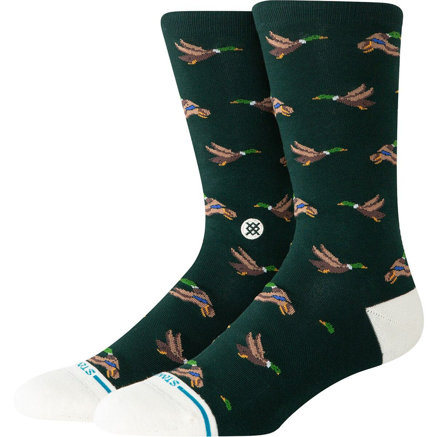 Dark green stance huntin socks with duck pattern on a white background