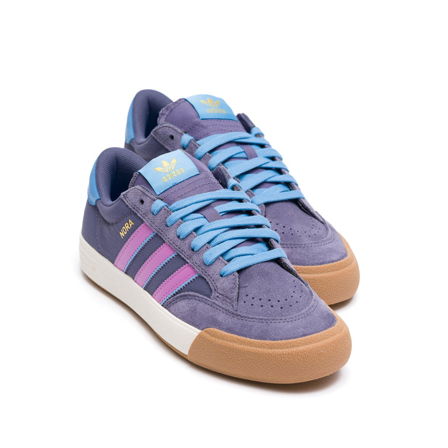 Purple adidas skateboarding sneaker with pink accents on a white background