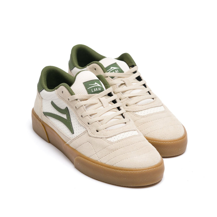 tan lakai cambridge skateboarding sneaker with green accents on a white background