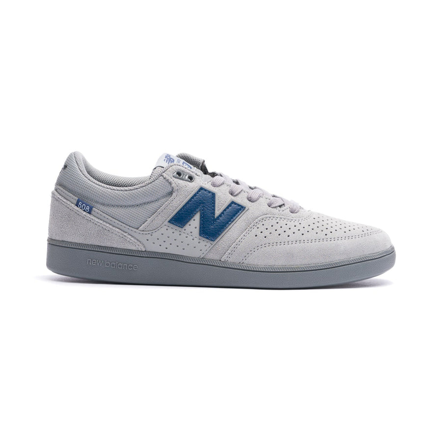 Gray new balance numeric 508 skatebard sneaker with blue accents on a white background