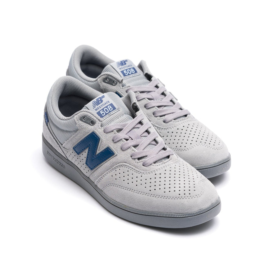 Gray new balance numeric 508 skatebard sneaker with blue accents on a white background