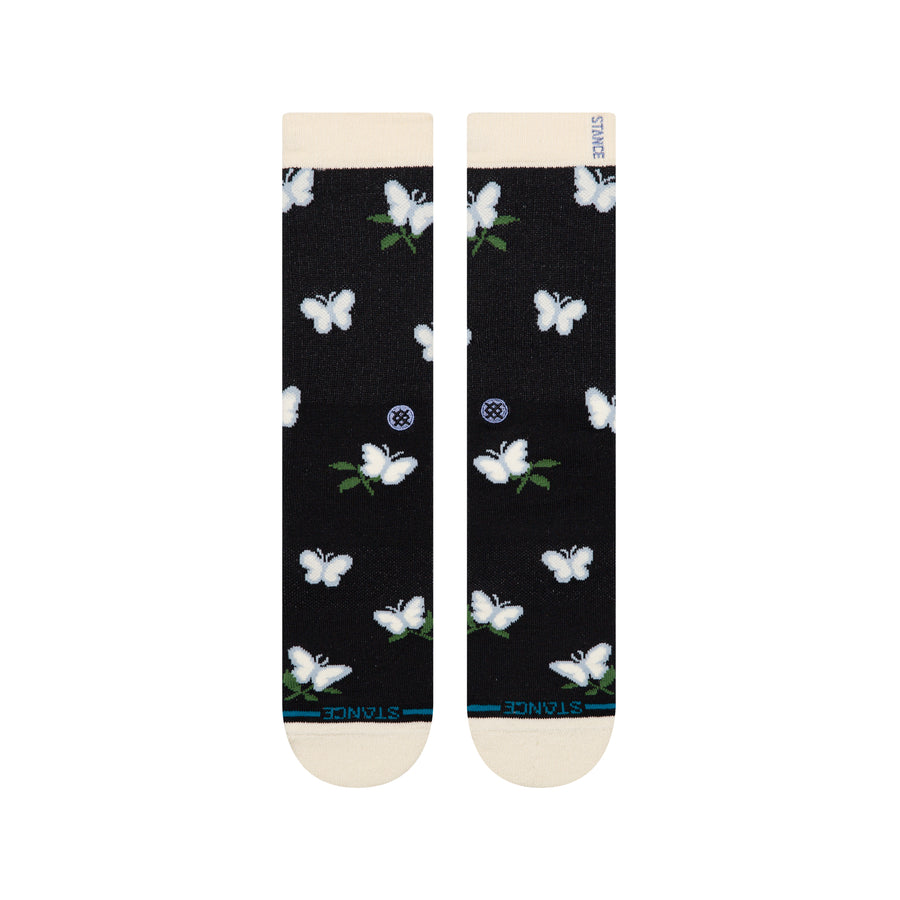 Black stance butterblend meadow socks with white butterfly patterns on a white background