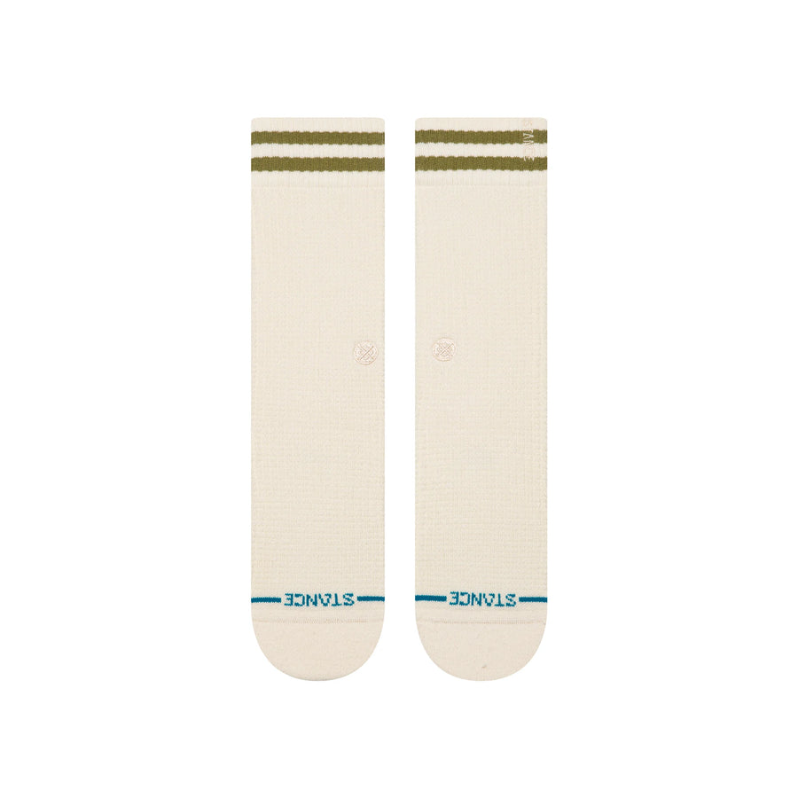 Pair of cream stance women's butterblend crew socks with green stripes on a white background