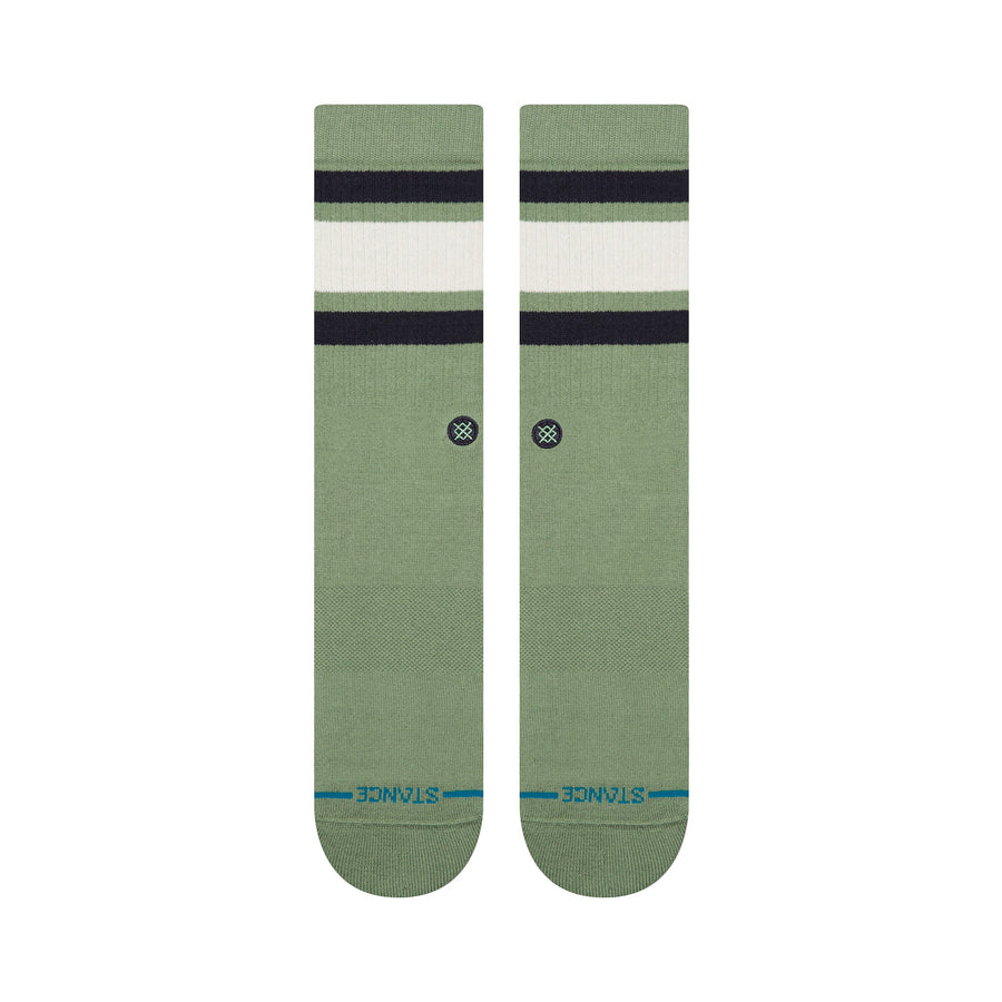 Pair of green stance men's boyd st crew socks with black and white stripes on a white background