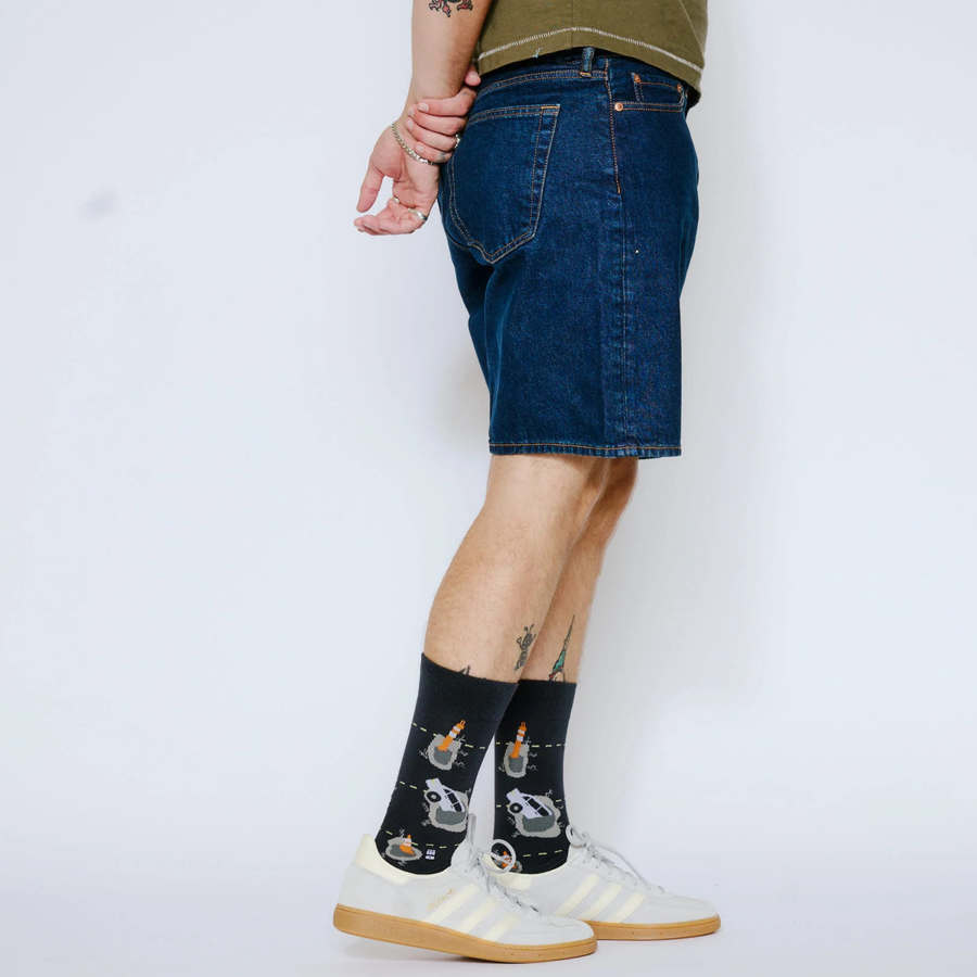 Pair of dark blue bonfolk pothole socks on a white background