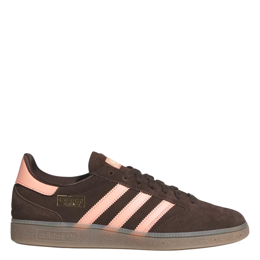 Brown Adidas busentiz adv skate sneaker with pink accents on a white background