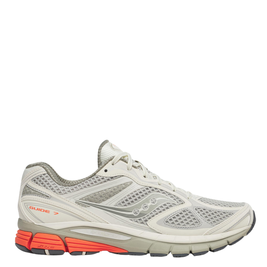 Gray tan saucony progrid guide 7 running shoe with orange sole on a white background