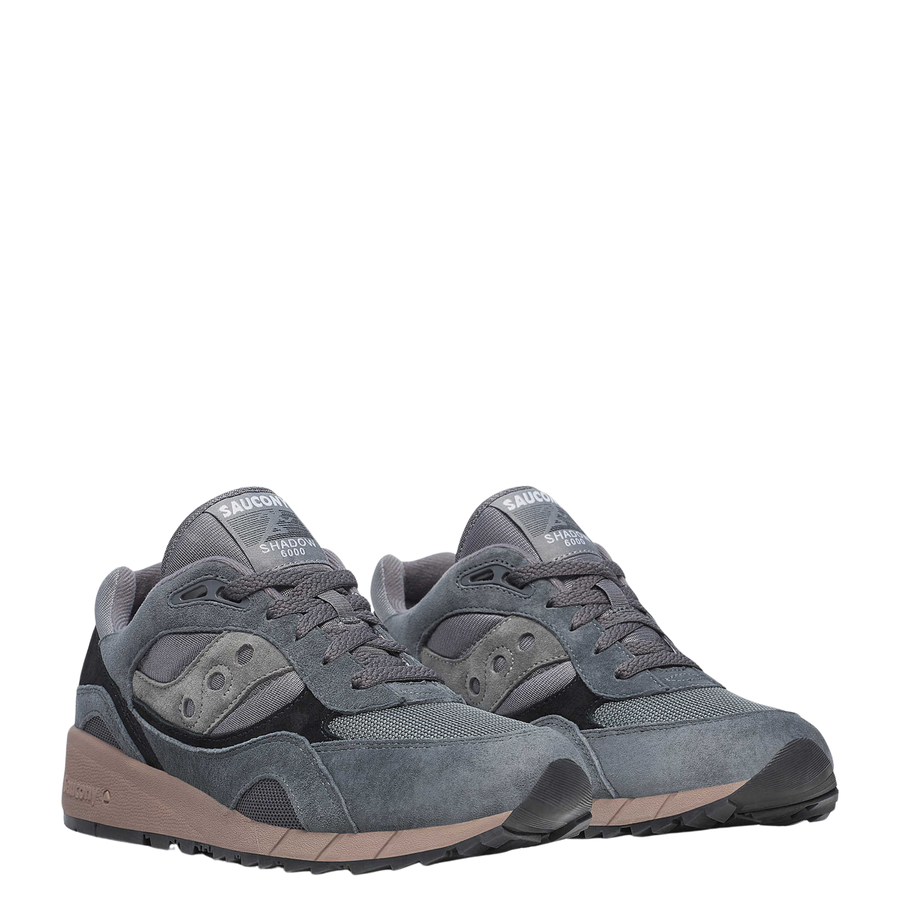 Gray men's saucony 6000 sneaker with brown sole on a white background