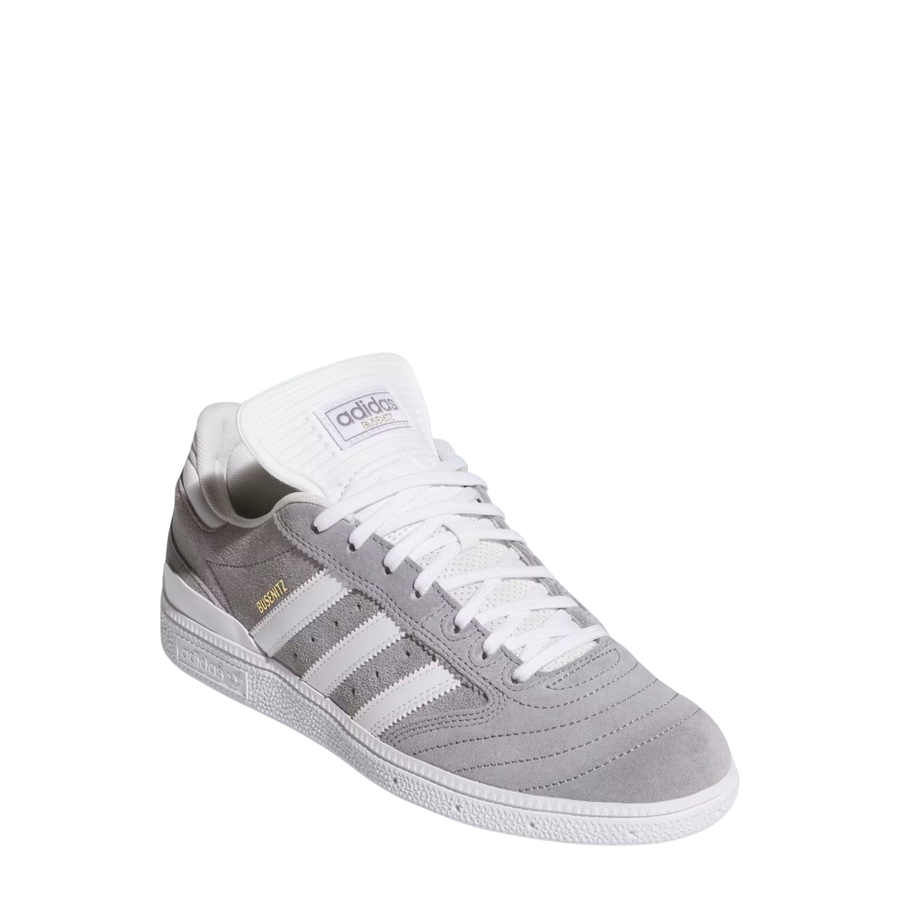 Gray Adidas busenitz skateboard sneaker with white stripes on a white background