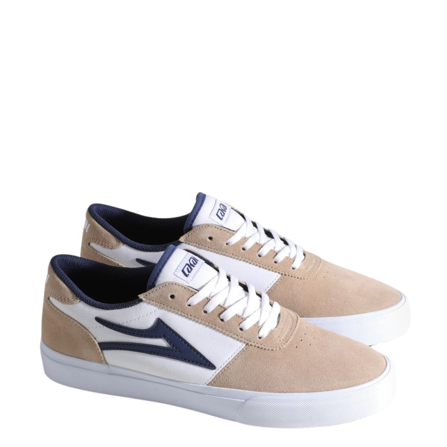 Beige and white lakai manchester skateboard sneaker with a blue logo on a white background