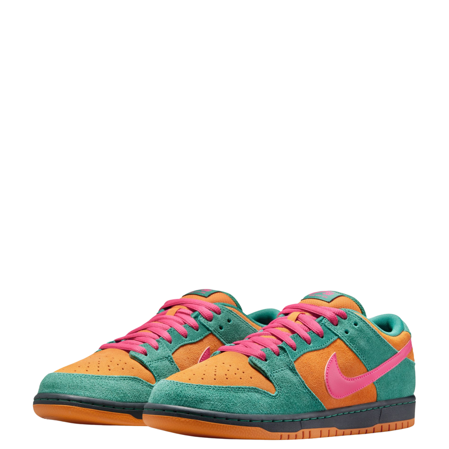A low-top Nike sb dunk low watermelon sneaker in a vibrant multicolor palette, featuring teal green suede, orange suede overlays, a bright pink Swoosh and laces, and a black and orange sole, shown against a plain white background.