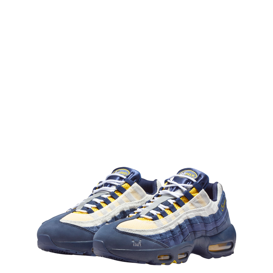 Blue and yellow nike sb air max 95 eric koston sneaker on a white background