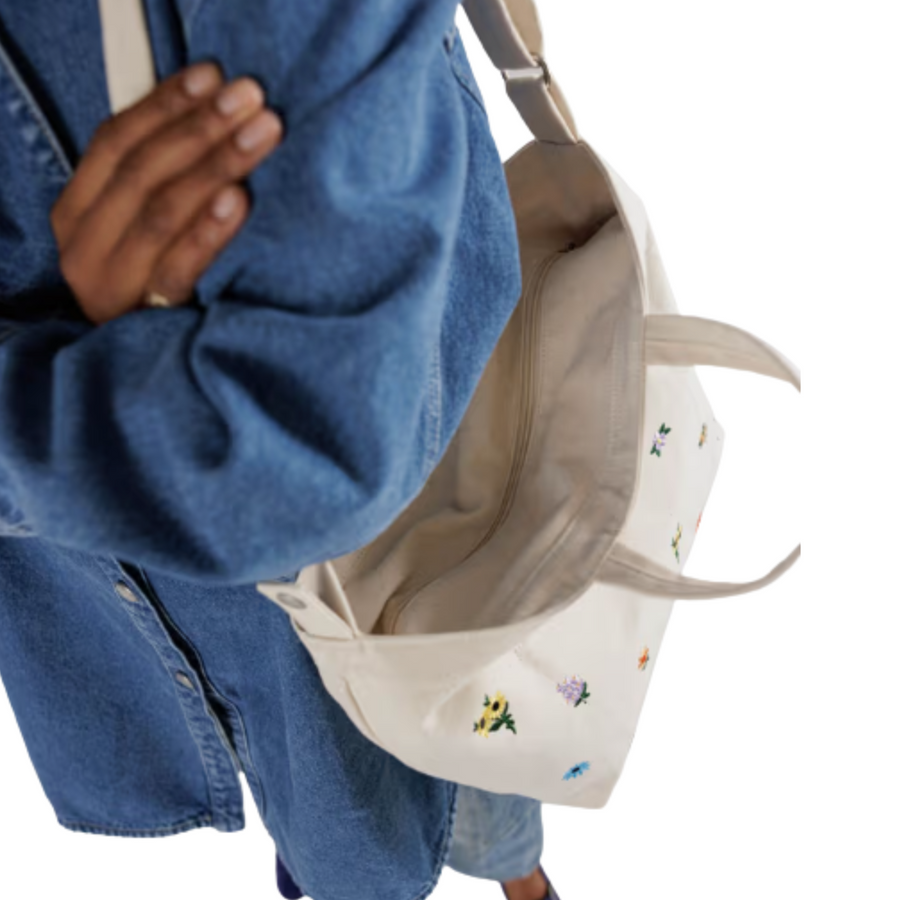 Beige baggu horizontal zip duck tote bag with floral embroidery on a white background
