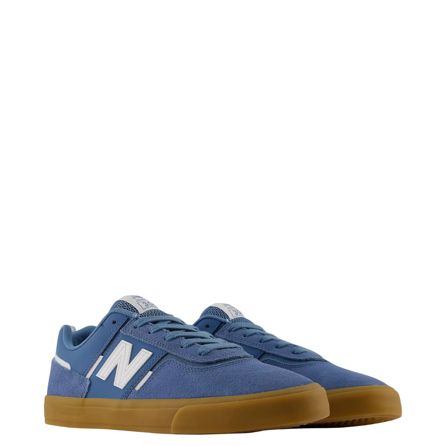 blue men's new balance numeric jamie foy 306 skate shoe with grey details and gum sole on a white background