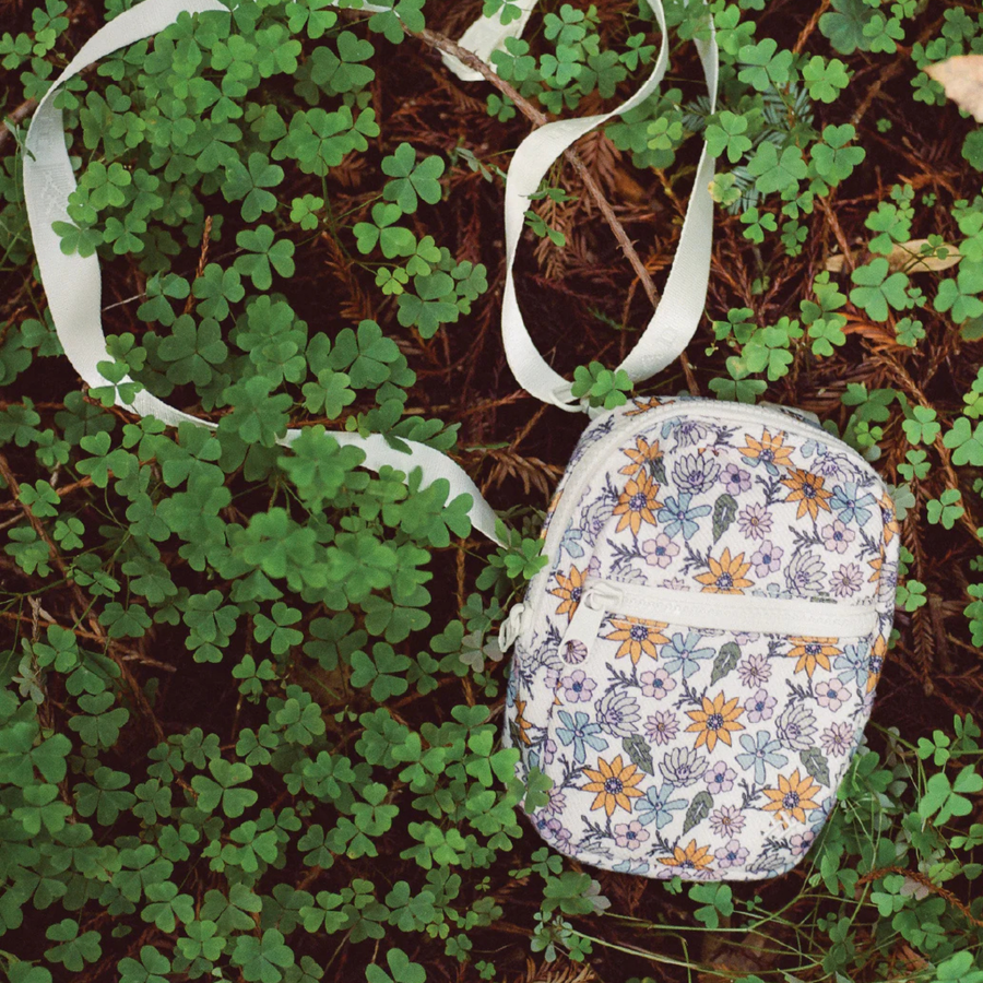 Floral-patterned thread crossbody bag on a white background