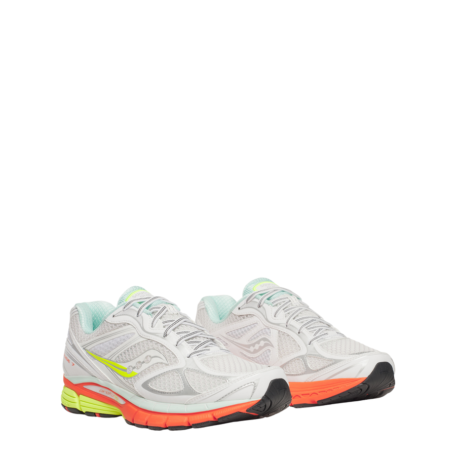 White saucony progrid guide 7 running shoe with colorful sole on a white background