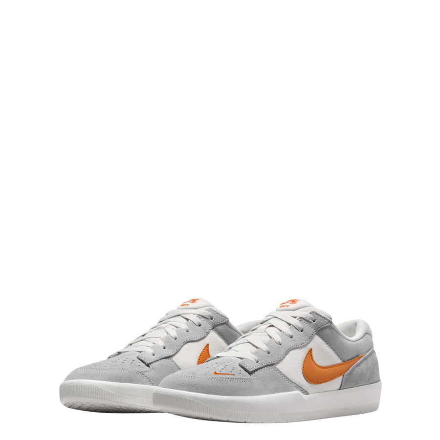 Gray NIKE SB men's force 58 sneaker with orange swoosh logo on a white background