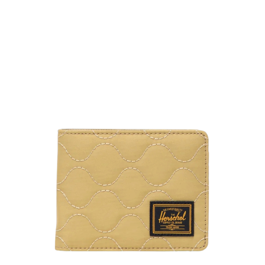 tan quilted herschel roy wallet on a white background