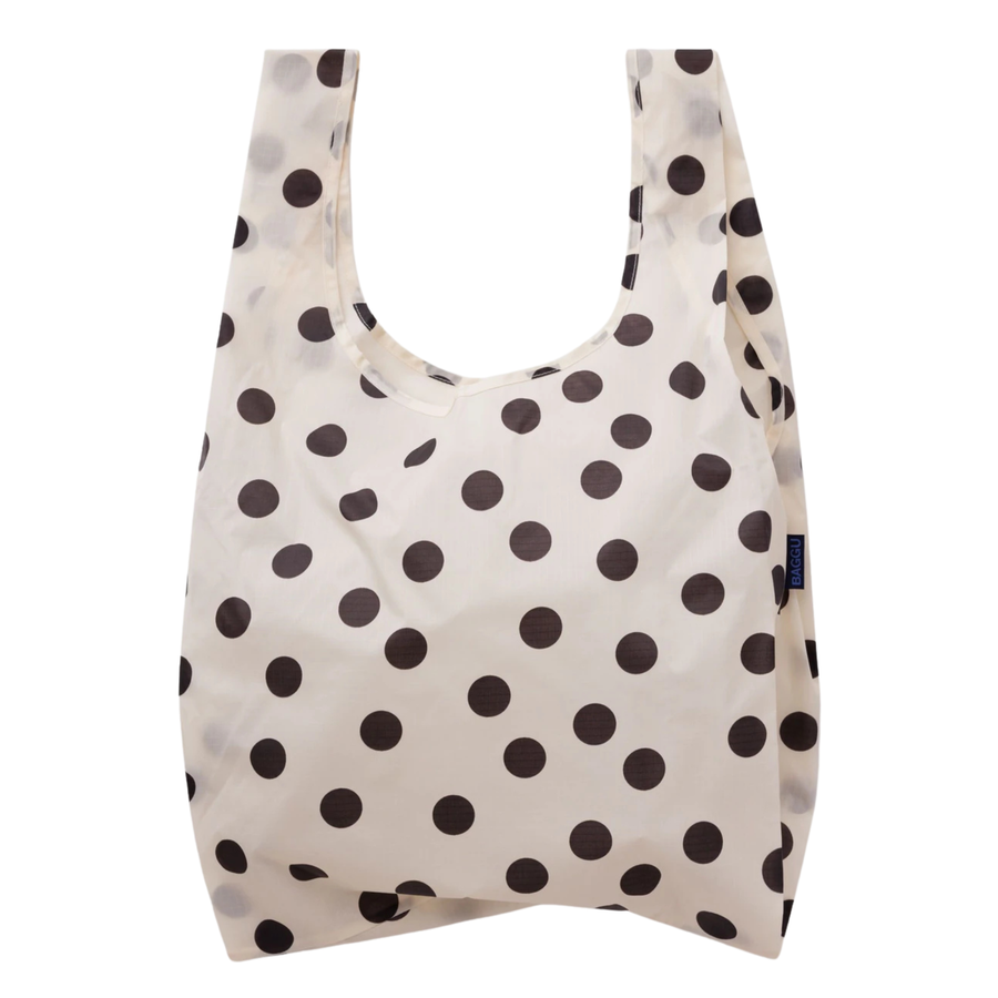cream colored standard baggu reusable tote with black polka dots on a white backgroun