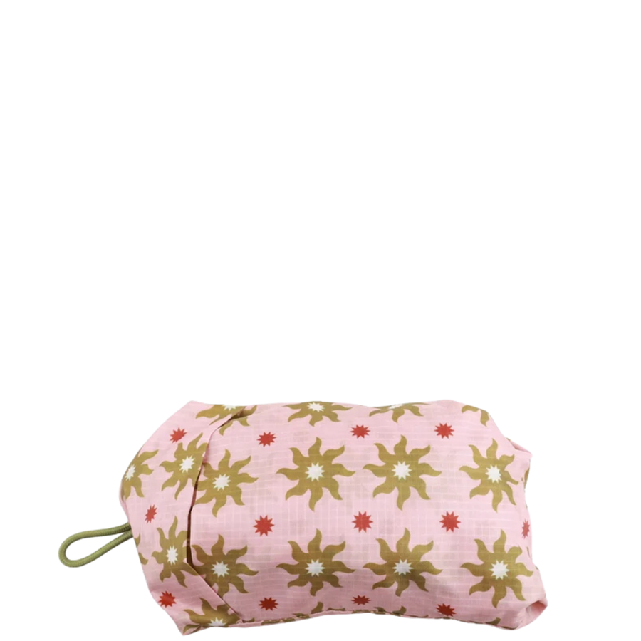 pink colored thread packable tote bag with Olive sun design on a white background