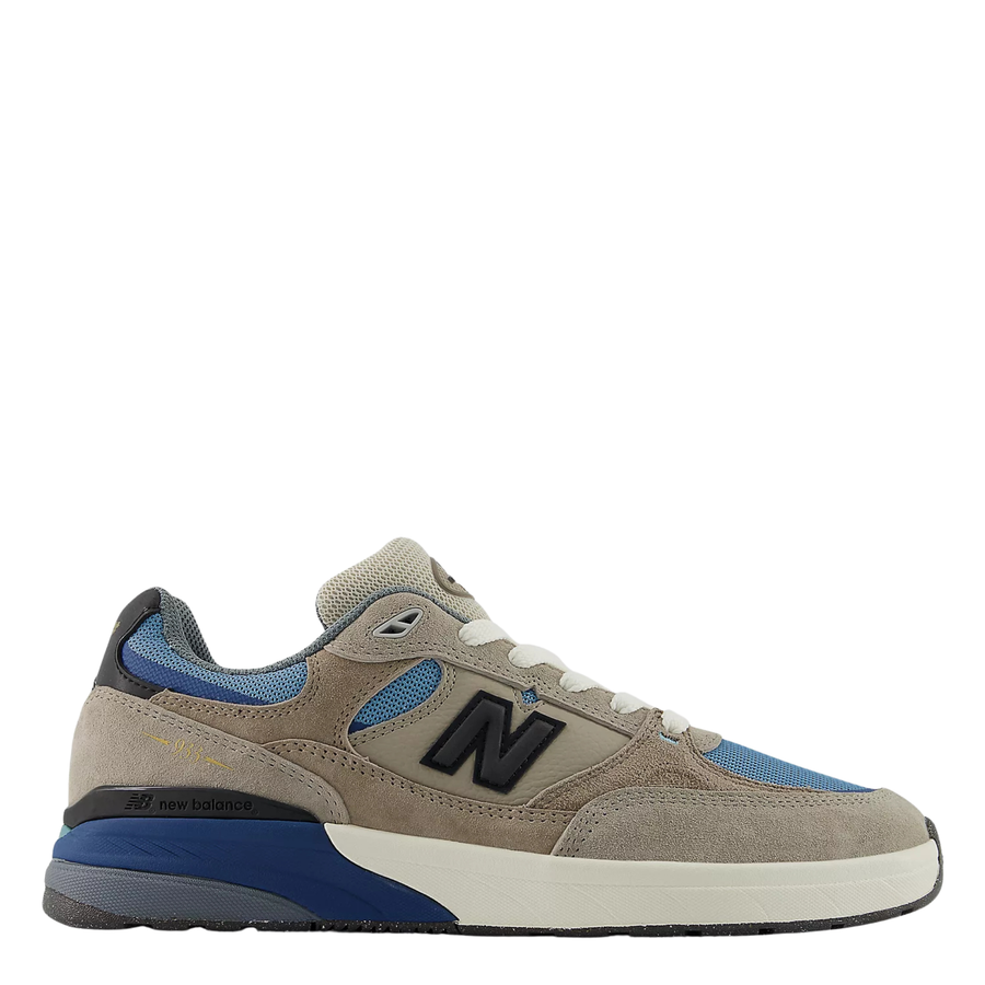 Beige and blue andrew reynolds 933 skateboard sneaker with New Balance logo on a white background