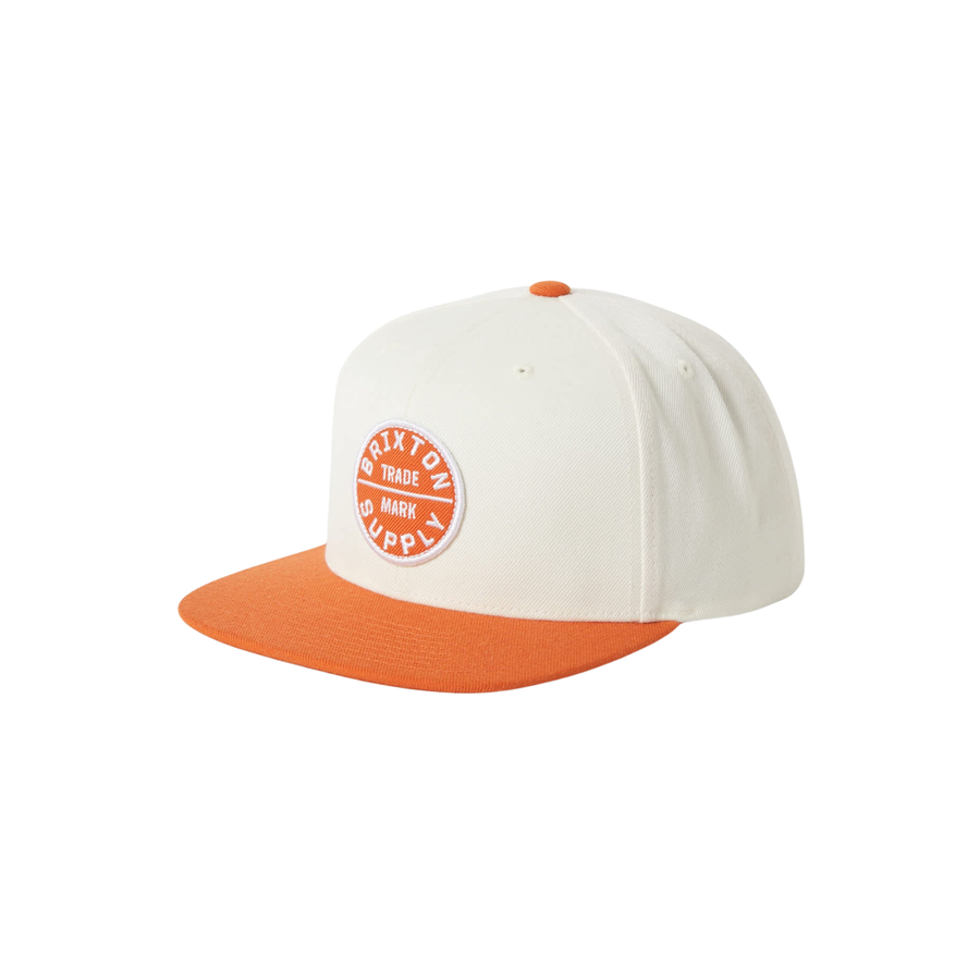white brixton oath iii snapback hat with orange bill and orange brixton supply logo on a white background