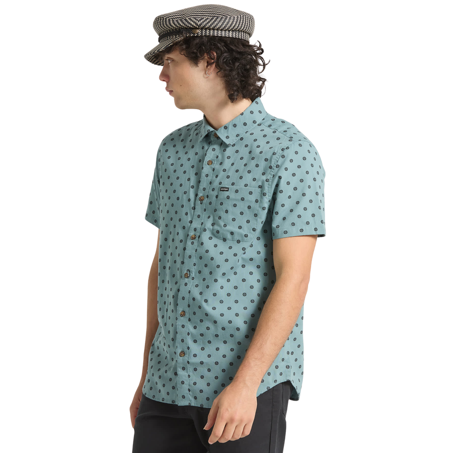 blue brixton charter print short sleeve woven men's shirt with contrast pattern on a person