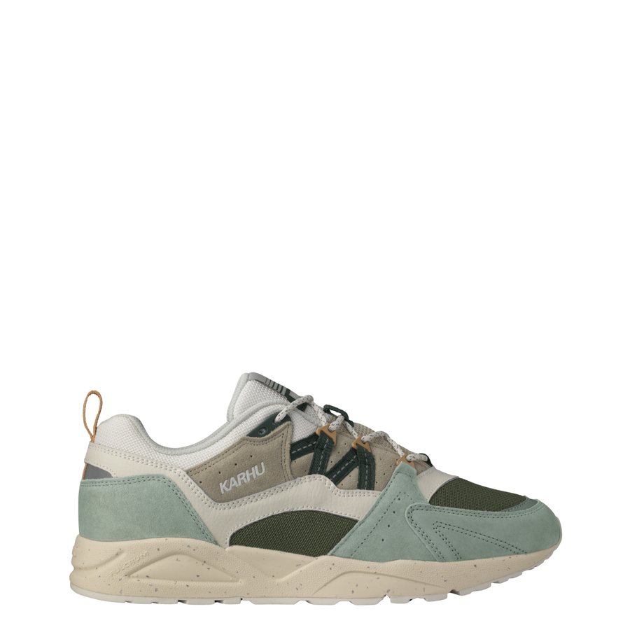 Karhu fusion 2.0 sneakers in a muted sage green, beige, and dark gray colorway, shown from a three-quarters angle against a plain white background.
