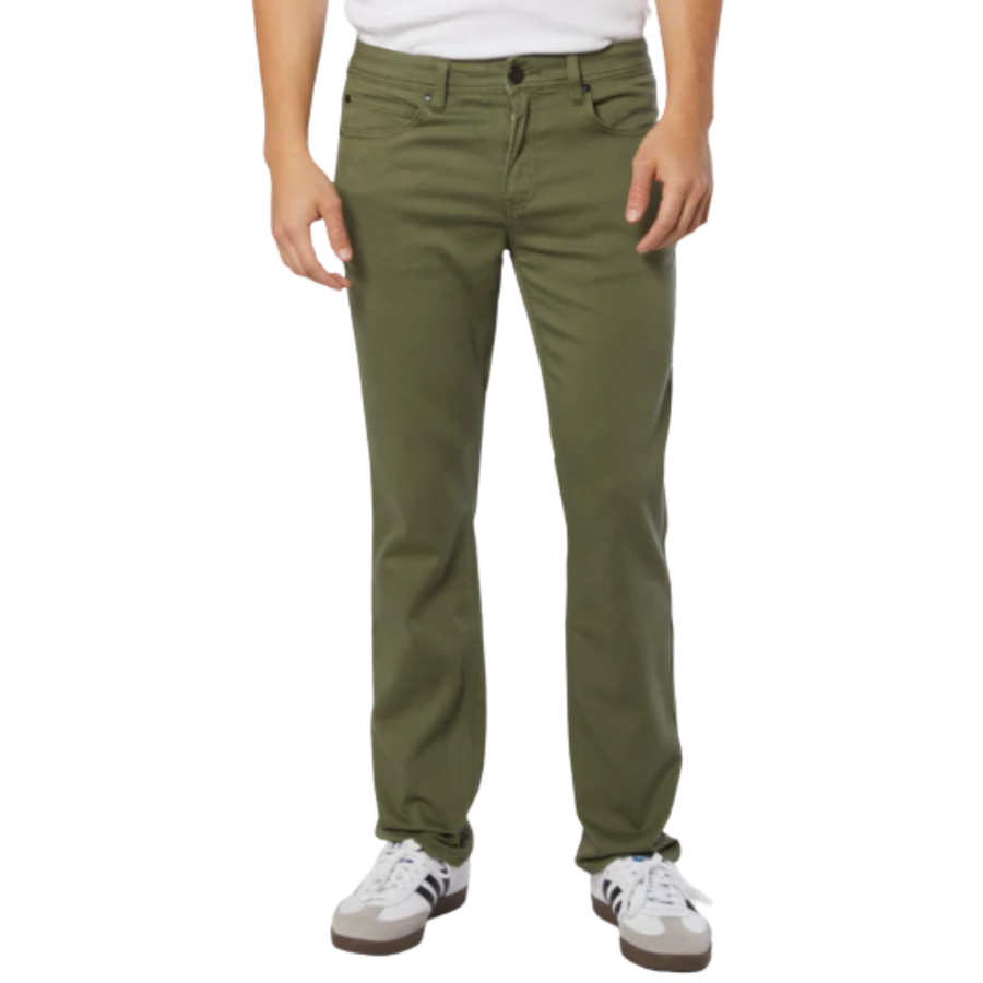 Person wearing military green ezekiel now denim pants on a white background