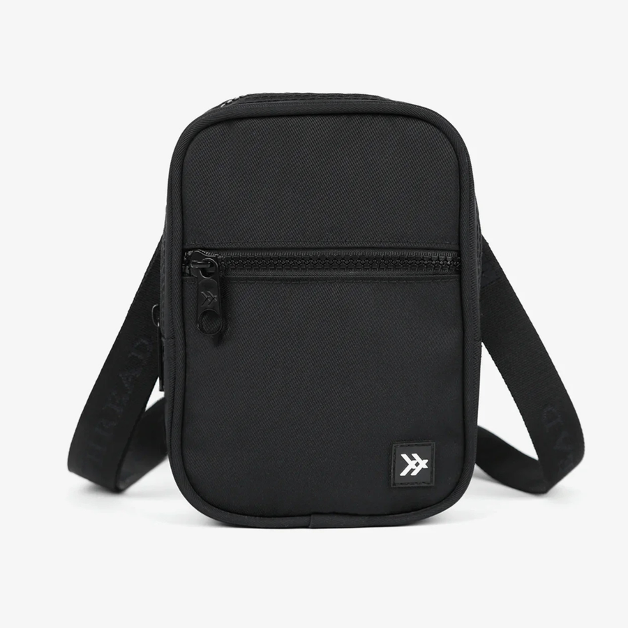 Black thread crossbody bag on a white background