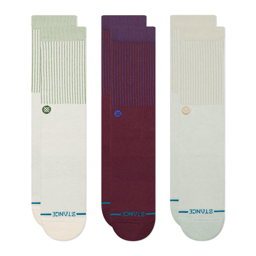 Three pairs of stance icon socks in green, purple, and beige with 'Stance' branding on a white background.