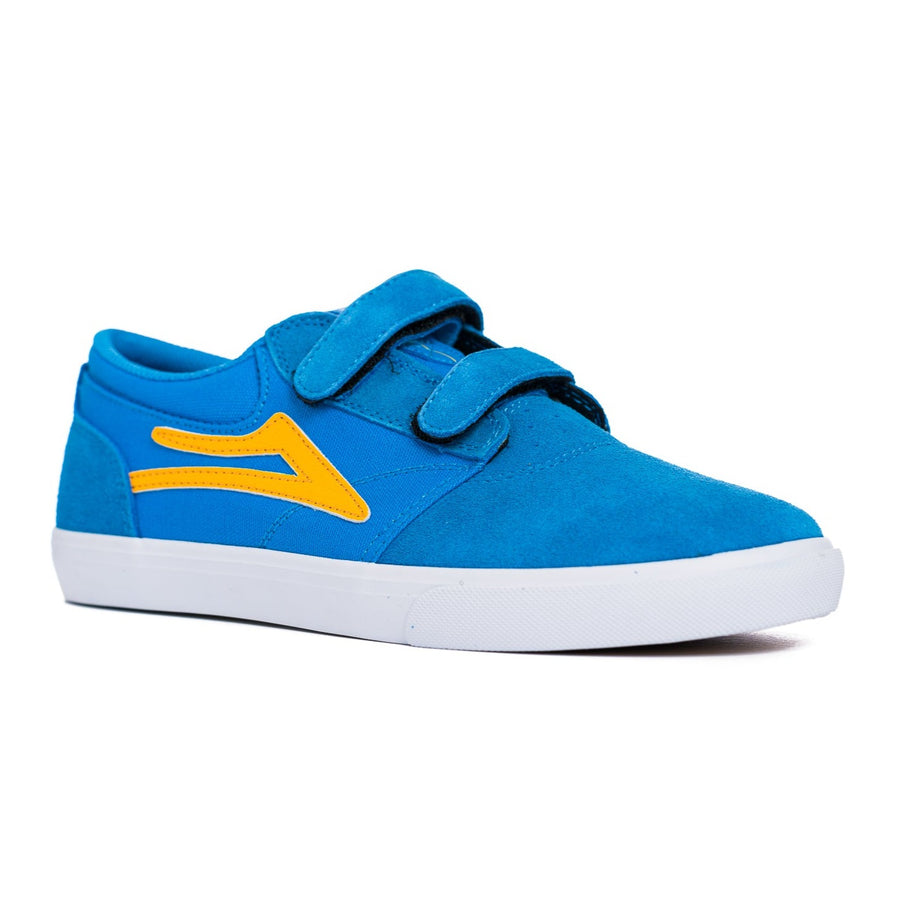 blue lakai kid's skate shoe with velcro straps, yellow logo and a white sole