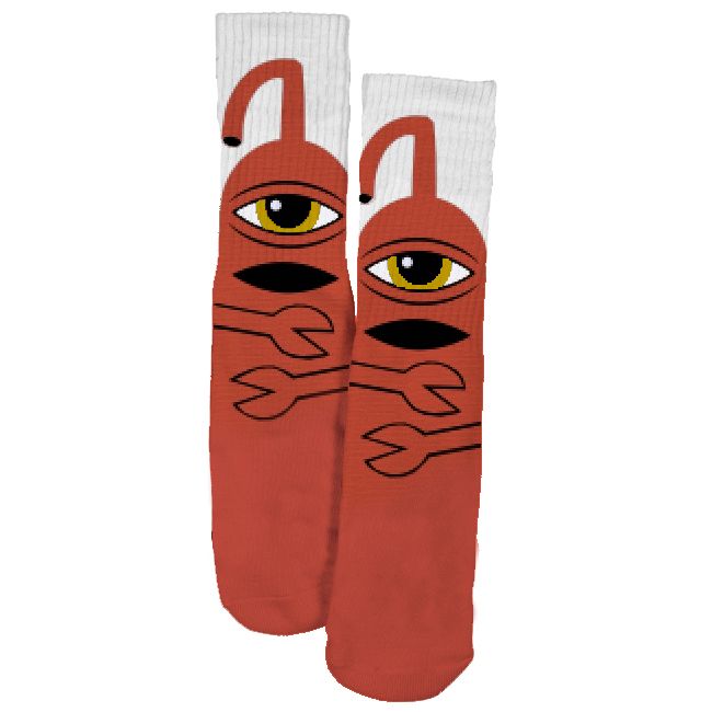 Pair of toy machine skateboards socks with one eyed monster on a white background