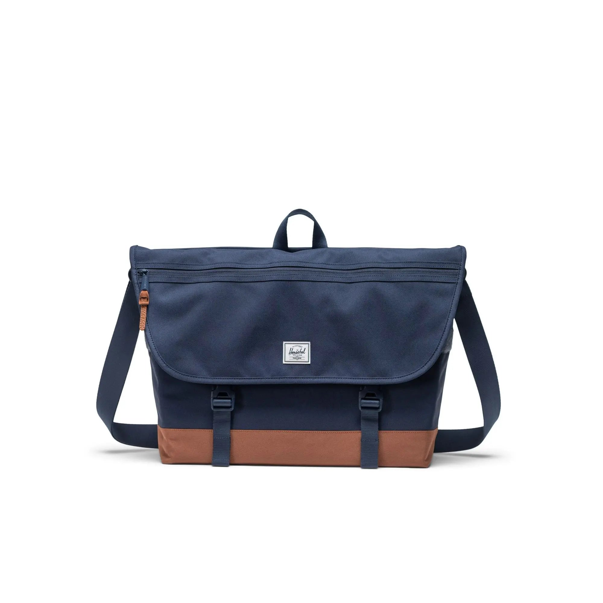 navy blue herschel cove mesesenger bag with tan bottom