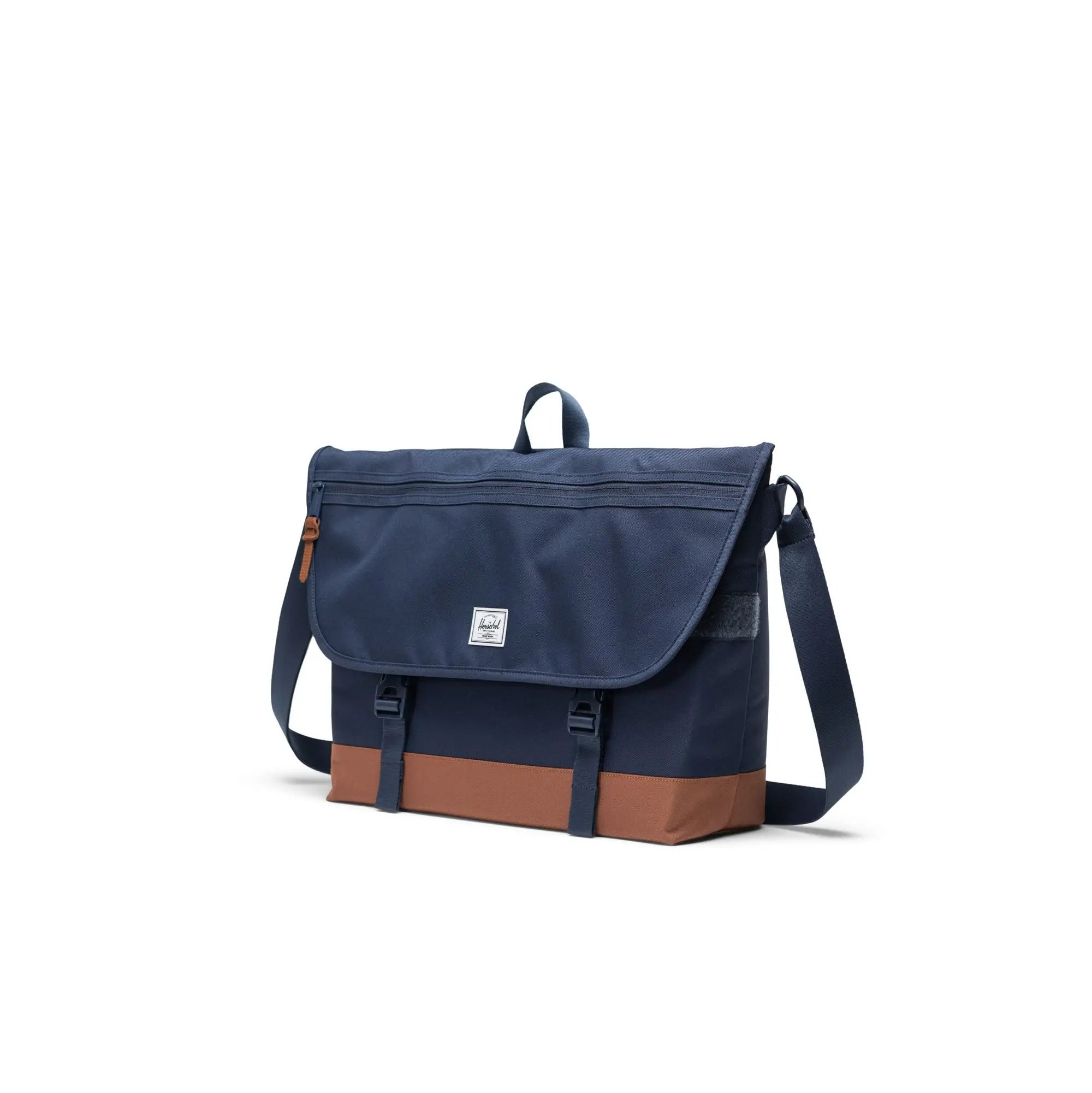 navy blue herschel cove mesesenger bag with tan bottom
