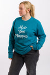 crew neck sweat shirt with the phrase Hug Your Peeps in white