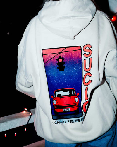 Off White sucio band hoodie with red and black text worn by a person